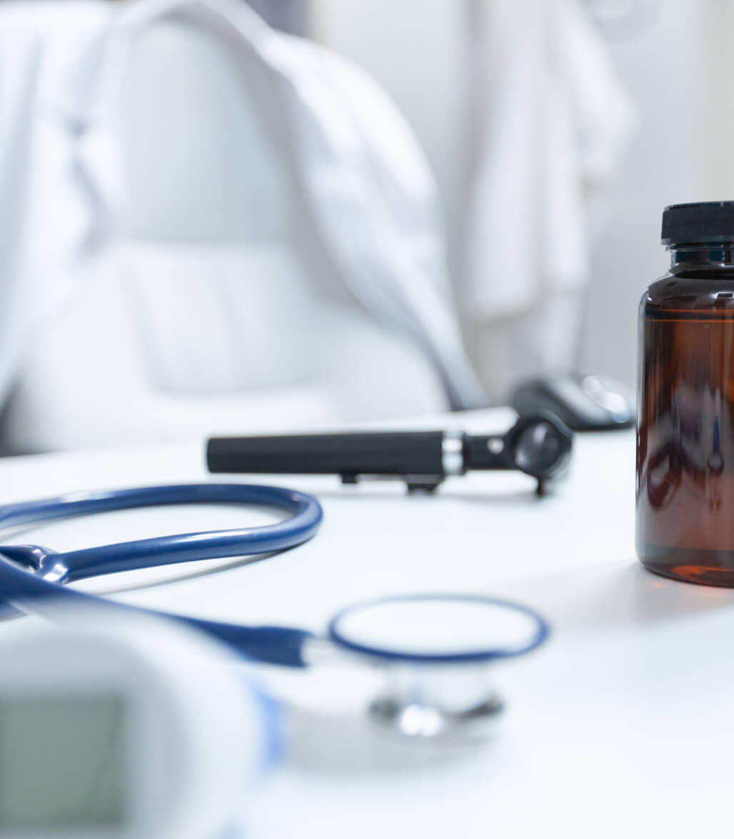 Tirzepatide injection vial with capped syringe on a clinical surface at a Laguna Beach weight loss clinic.